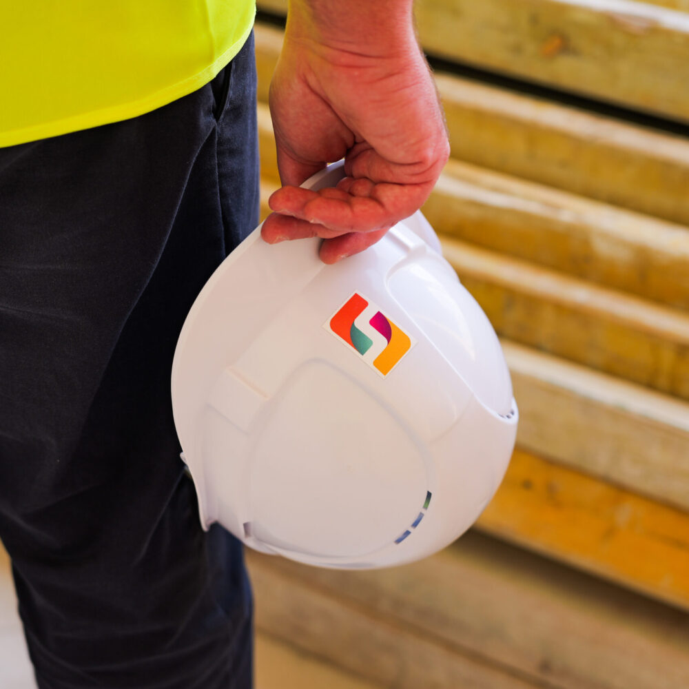 FTS employee holding a safety helmet